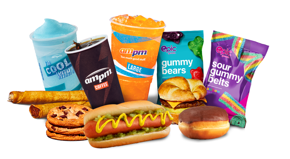 A hot dog, breakfast sandwich, donut, taquitos, sour gummy belts, gummy bears, and stack of 3 cookies beside a cup of coffee, large orange soda, and blue Freeze.