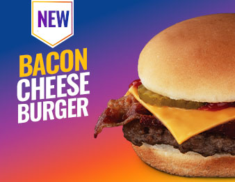 A bacon cheeseburger with ketchup and pickles