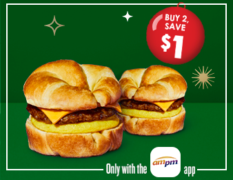 Two Sausage, Egg, and Cheese Croissant breakfast sandwiches with a red ornament. Buy 2, Save one dollar. Only with the A M P M app.