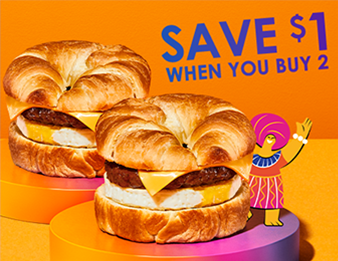 Two scrumptious Chorizo Sausage, Fried Egg & Cheese Croissants with a Luis Pinto animated character waving. Save $1 when you buy 2.