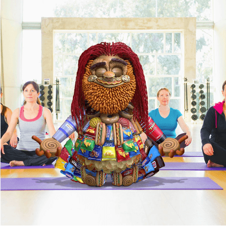 Image of Toomgis sitting on yoga mat.